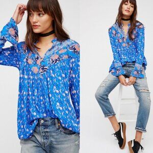 Free people blue floral long sleeve top.